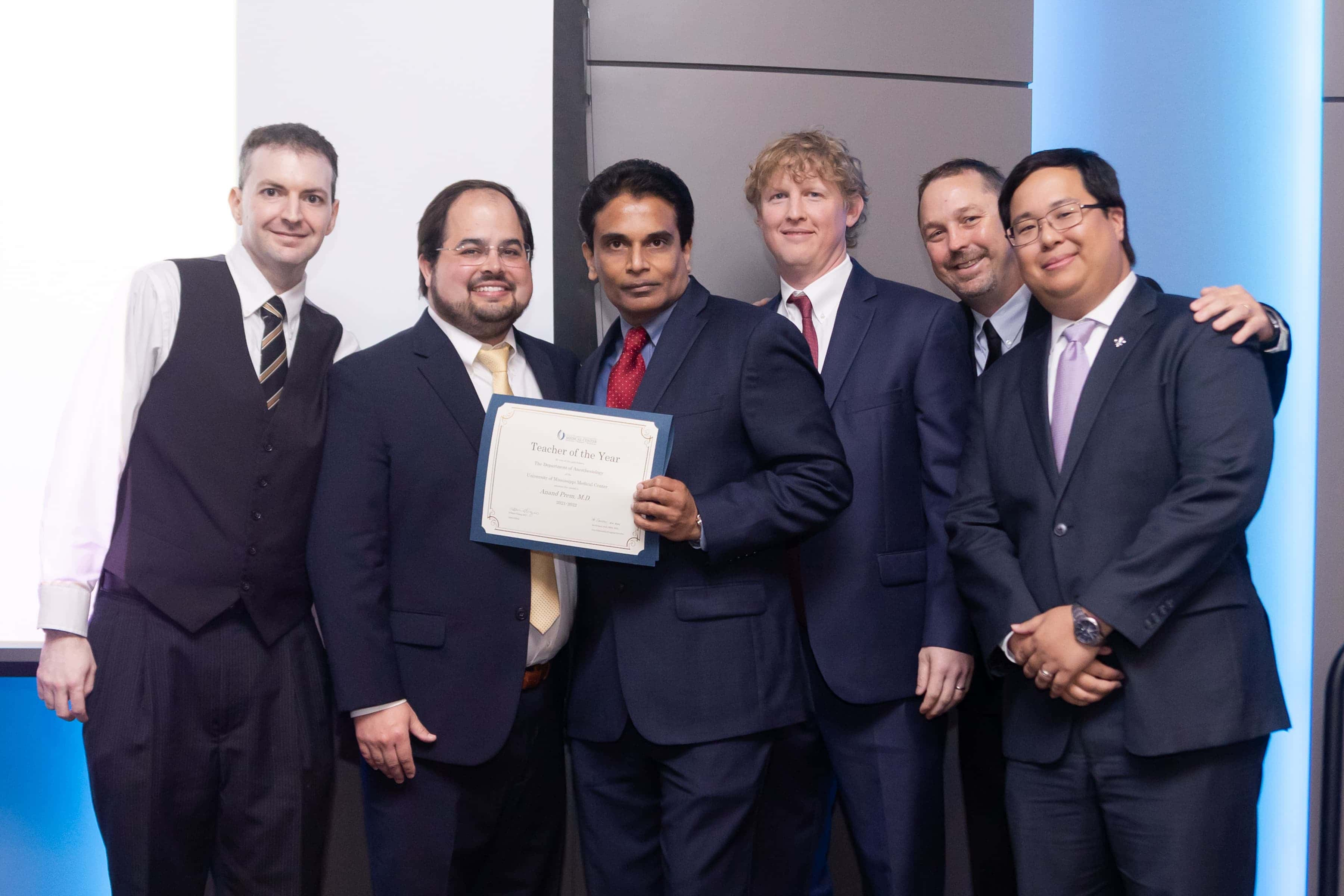 Dr. Anand Prem Receiving his Teacher of the Year Award from the Pain Fellows